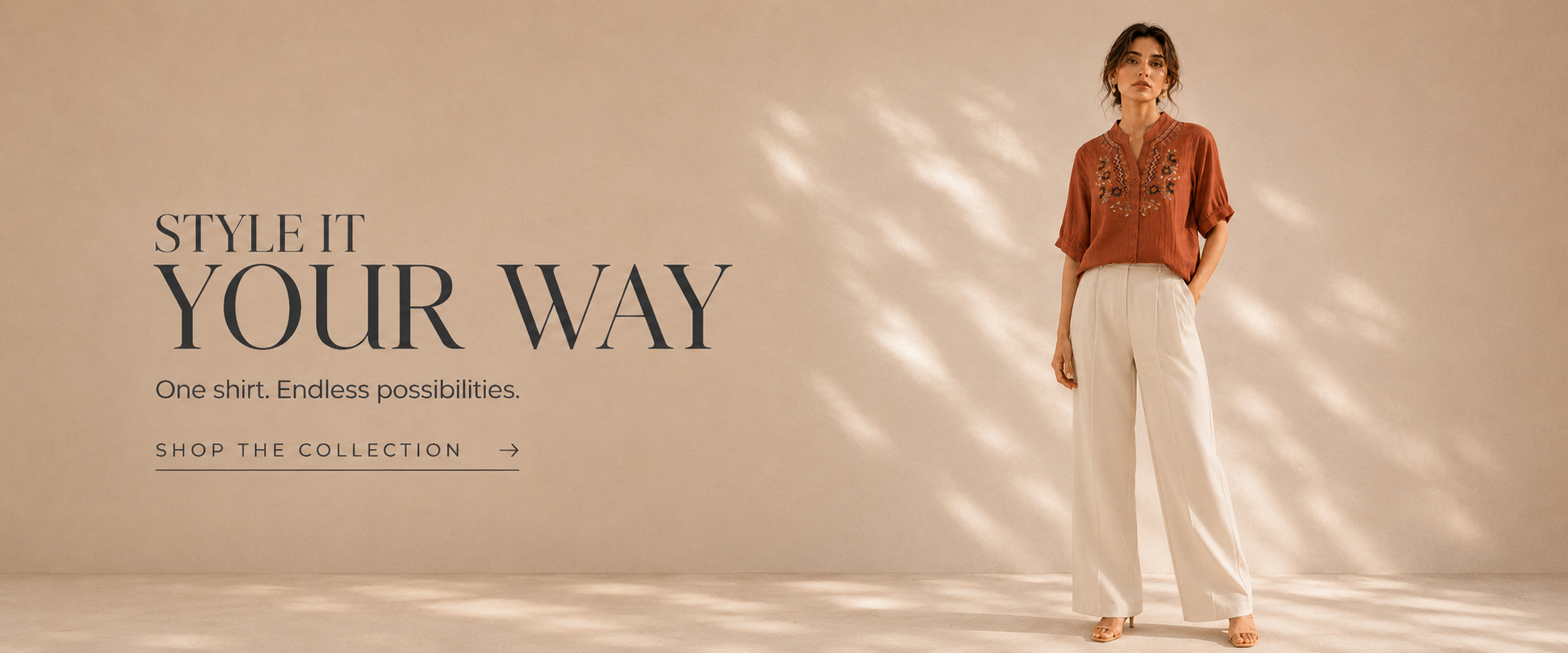 Woman wearing a orange embroidered cotton shirt. Style It Your Way. Our Edit. Effortless possibilities.