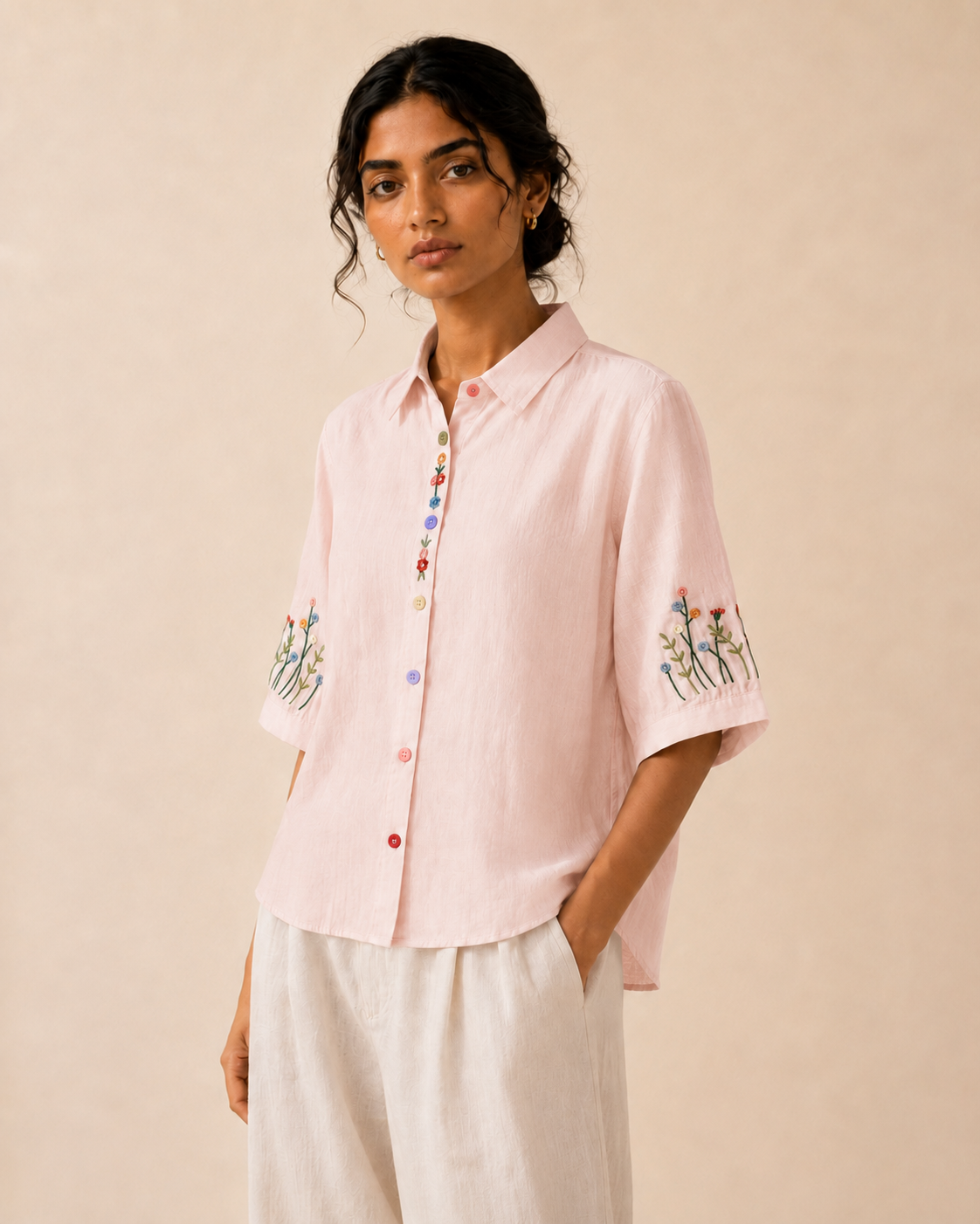 Alternate front view of the soft blush pink wildflower embroidered cotton shirt showing the relaxed fit and embroidery.
