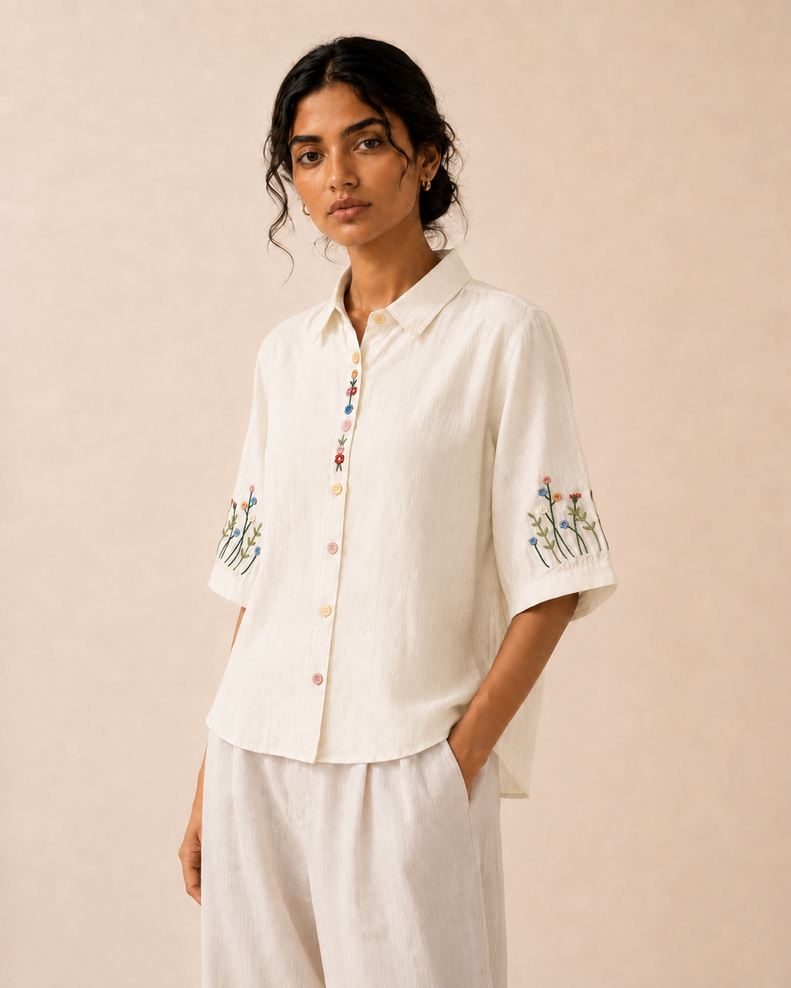 Alternate front view of the ivory wildflower embroidered cotton shirt showing the relaxed fit and embroidery.
